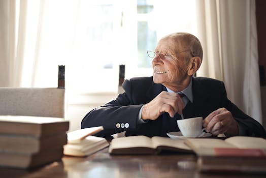 an academic working at a desk with a smile